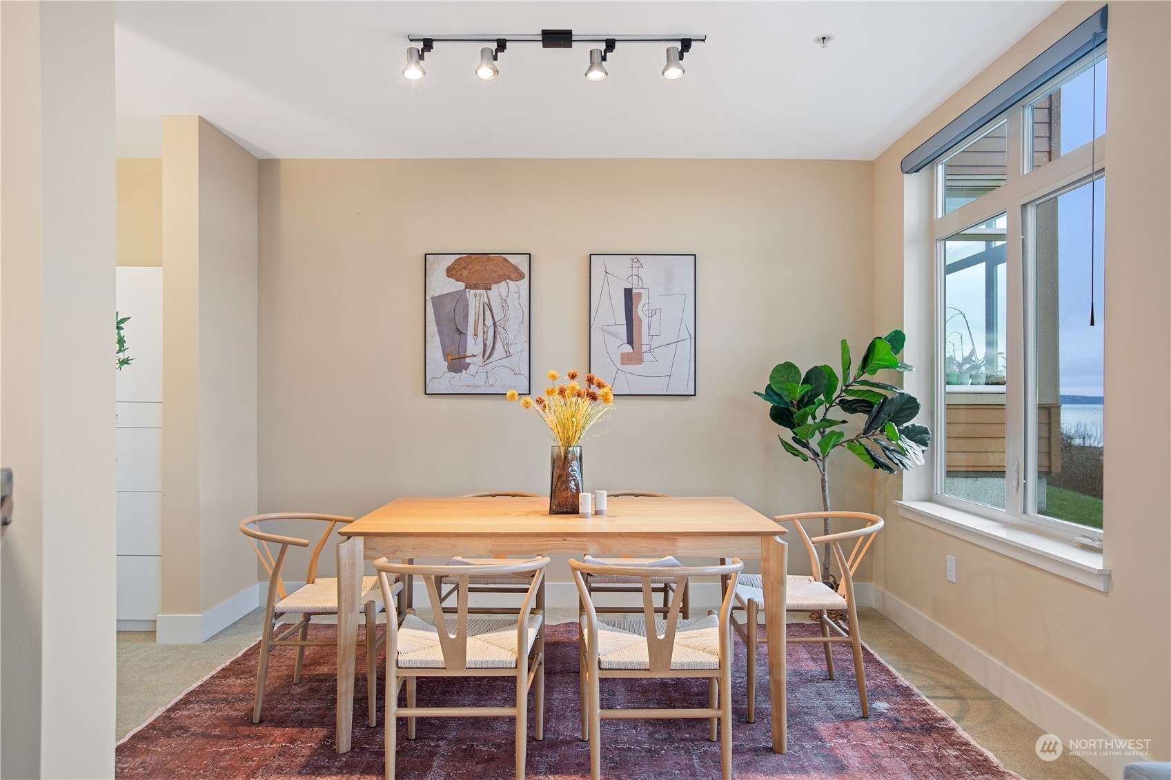 51 Pine Street, Unit 104 Edmonds, WA 98020 - Photo 11 of 40 a dining room with furniture and wooden floor