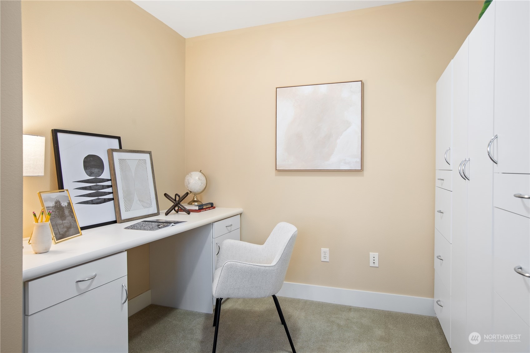 51 Pine Street, Unit 104 Edmonds, WA 98020 - Photo 14 of 40 a room with a wooden table and chairs