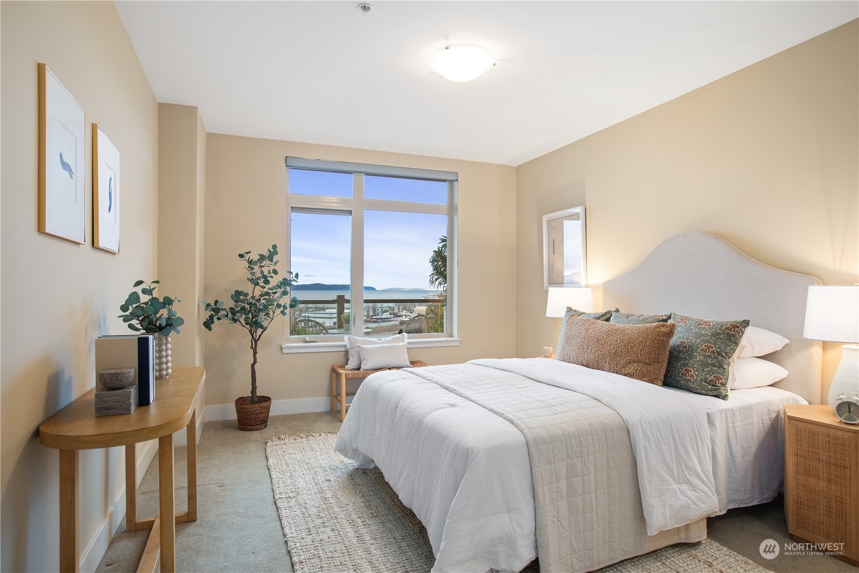 51 Pine Street, Unit 104 Edmonds, WA 98020 - Photo 20 of 40 a bedroom with a bed and a potted plant