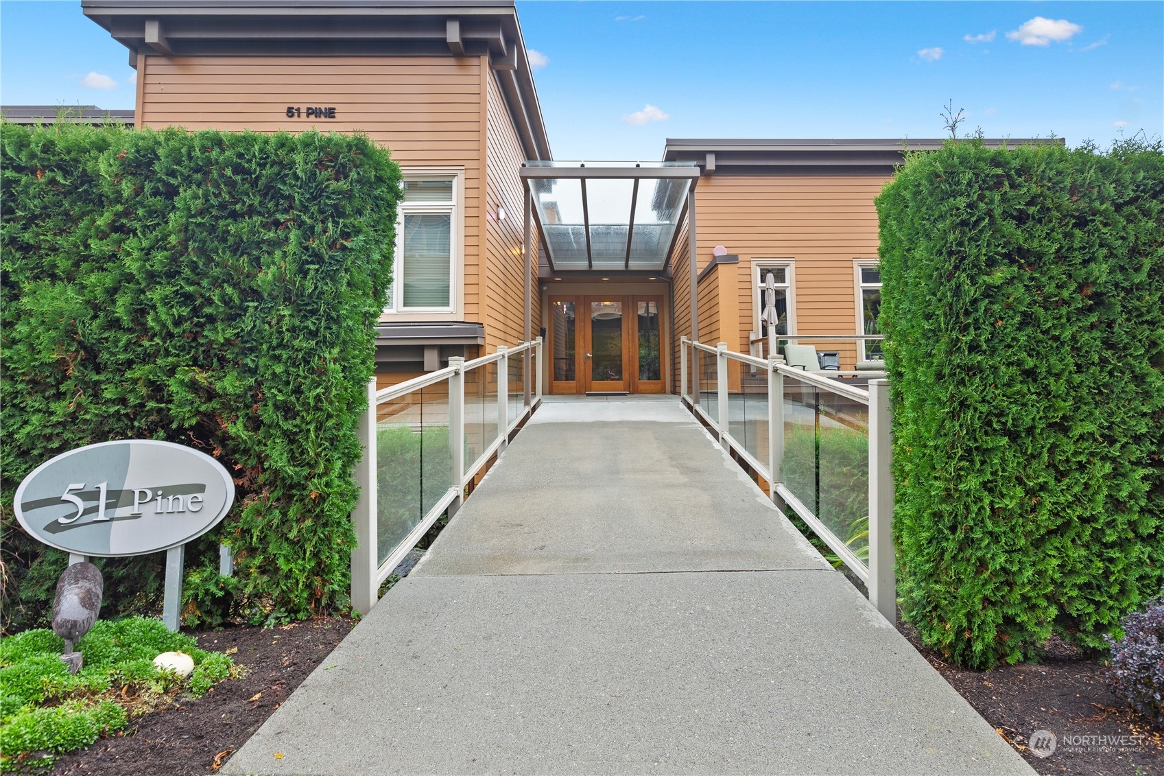 51 Pine Street, Unit 104 Edmonds, WA 98020 - Photo 2 of 40 a view of a back yard from a balcony