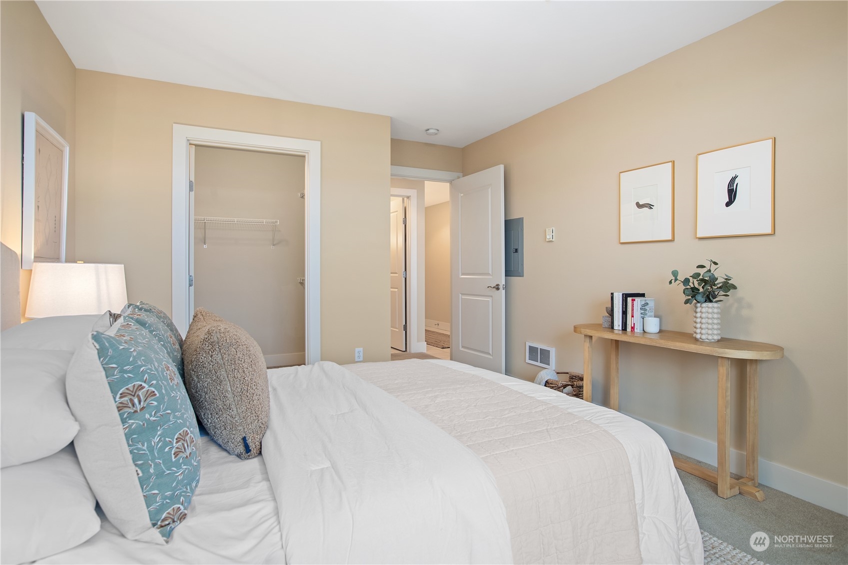 51 Pine Street, Unit 104 Edmonds, WA 98020 - Photo 21 of 40 a bedroom with a bed and a desk