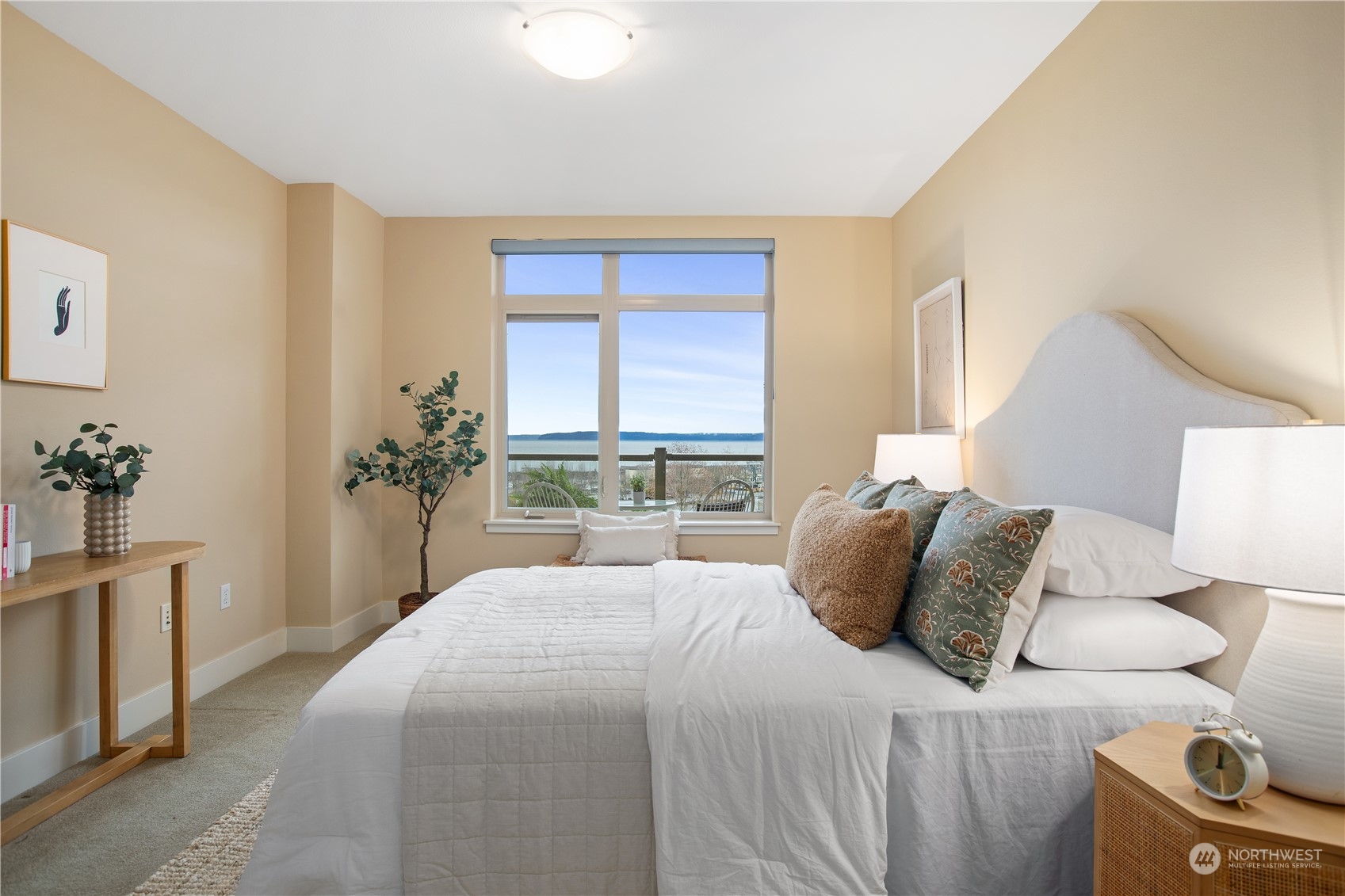 51 Pine Street, Unit 104 Edmonds, WA 98020 - Photo 22 of 40 a bedroom with a bed and a potted plant