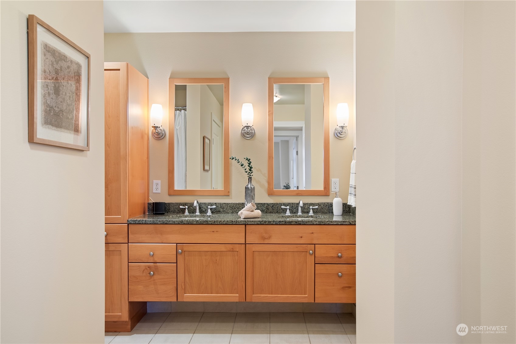 51 Pine Street, Unit 104 Edmonds, WA 98020 - Photo 25 of 40 a bathroom with a sink and a mirror