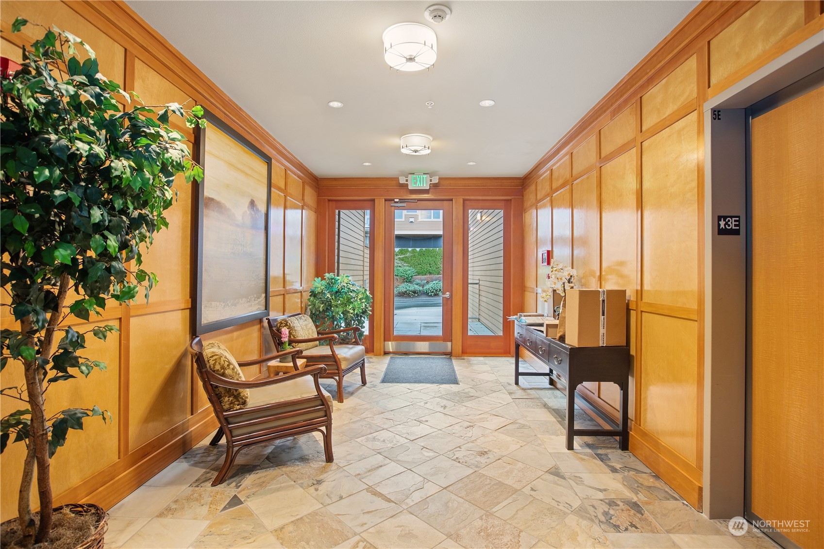 51 Pine Street, Unit 104 Edmonds, WA 98020 - Photo 3 of 40 a living room with furniture and a floor to ceiling window