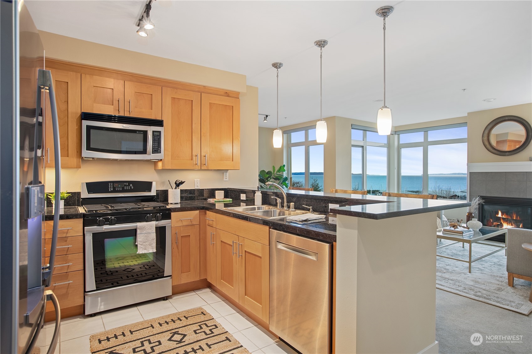 51 Pine Street, Unit 104 Edmonds, WA 98020 - Photo 5 of 40 a kitchen with a stove and a microwave