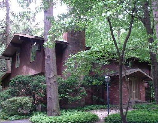a view of a house with a tree