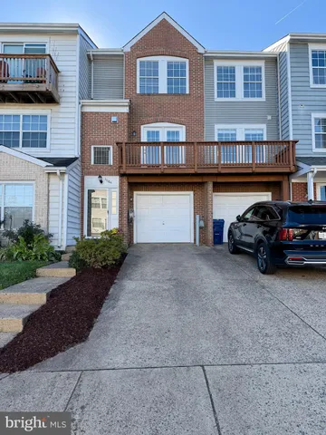a car parked in front of a brick house