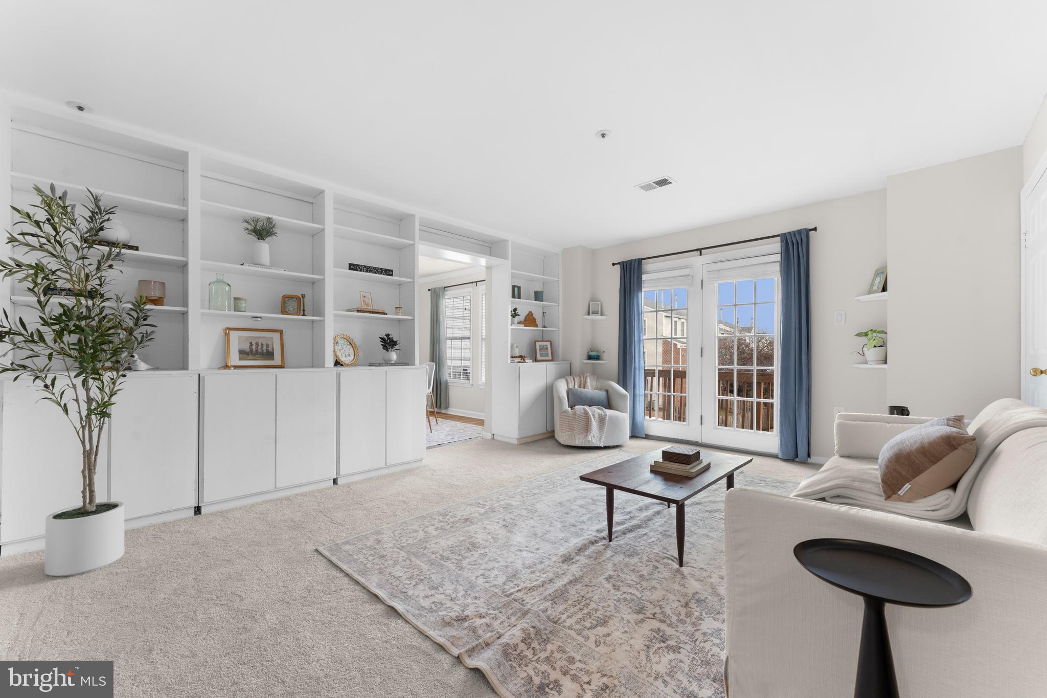 11184 Stagestone Way Manassas, VA 20109 - Photo 11 of 38 a living room with furniture and a potted plant