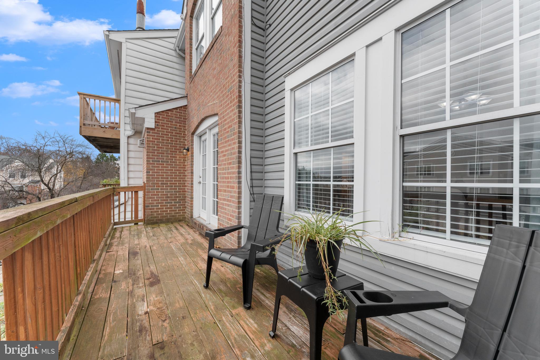 11184 Stagestone Way Manassas, VA 20109 - Photo 14 of 38 a balcony with wooden floor and furniture