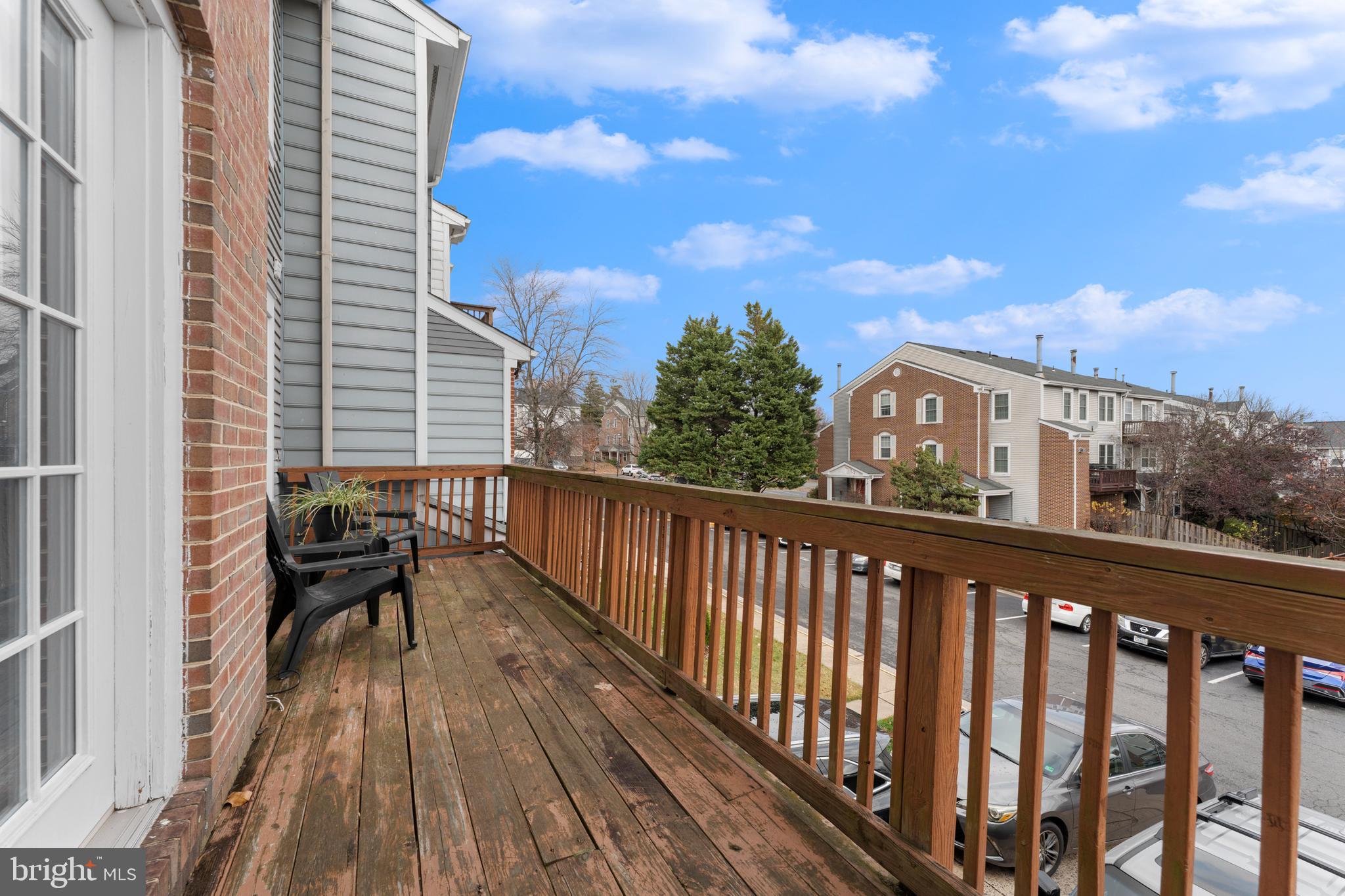 11184 Stagestone Way Manassas, VA 20109 - Photo 15 of 38 a view of a balcony with wooden floor and city view