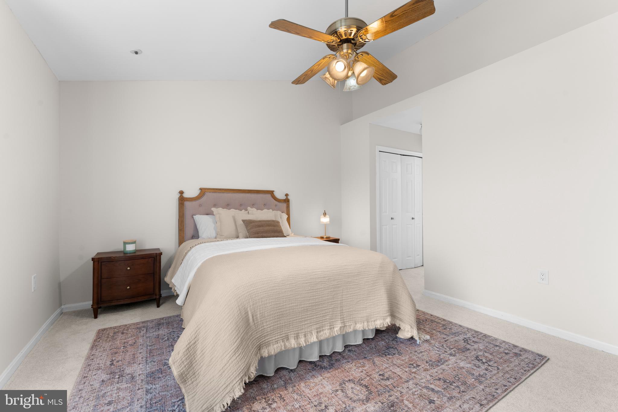 11184 Stagestone Way Manassas, VA 20109 - Photo 26 of 38 a bedroom with a bed and a chandelier