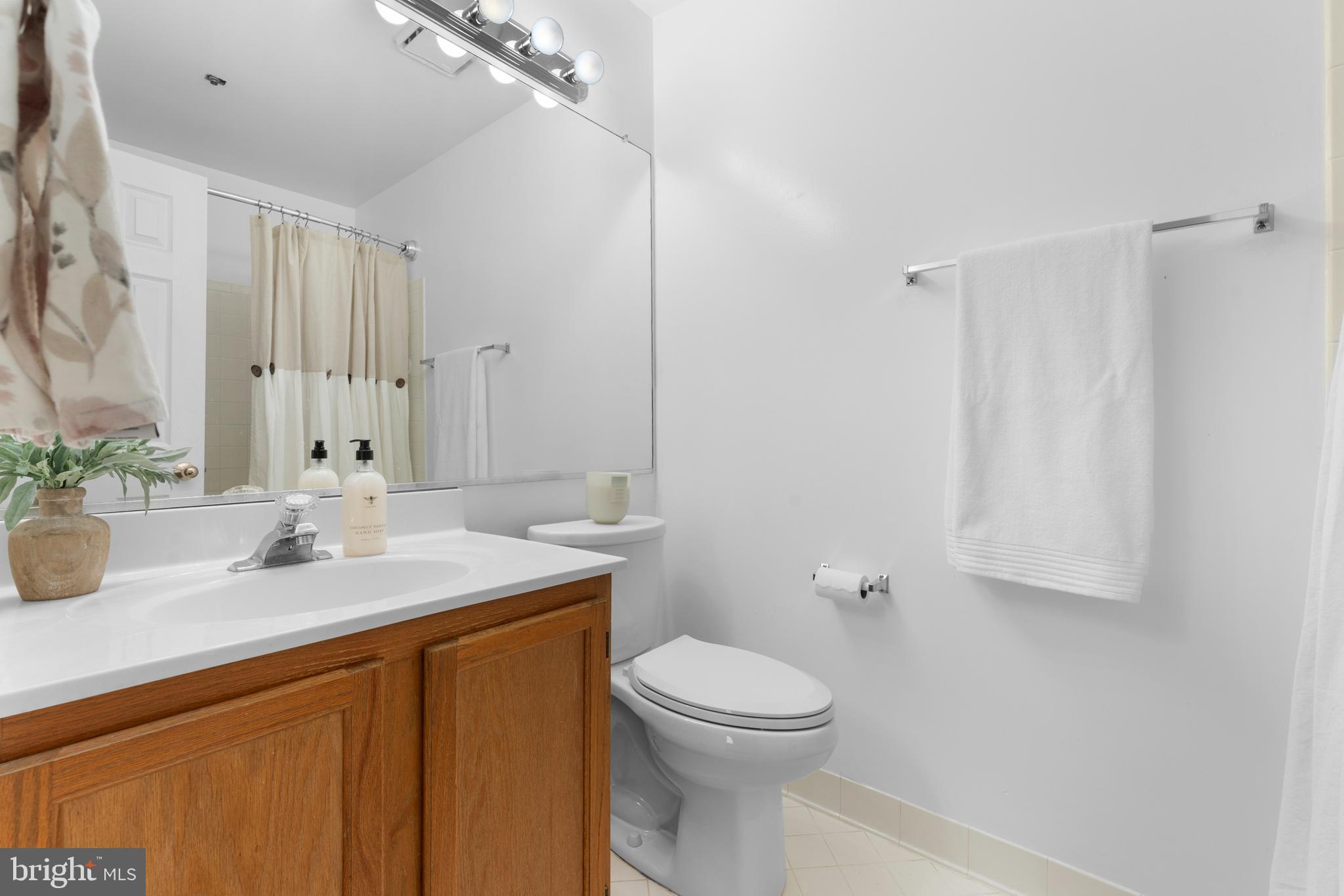 11184 Stagestone Way Manassas, VA 20109 - Photo 28 of 38 a bathroom with a sink a toilet and a mirror