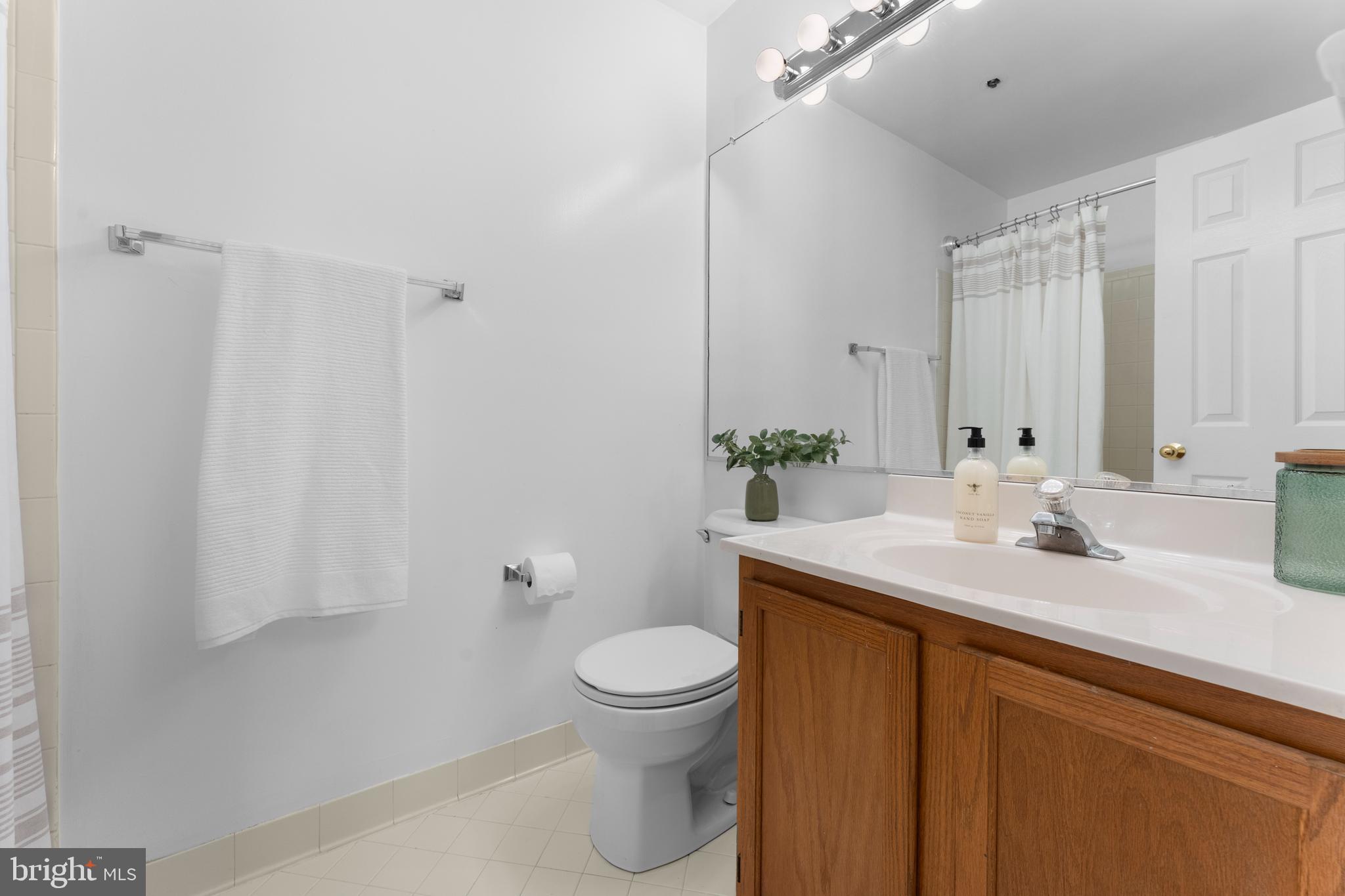 11184 Stagestone Way Manassas, VA 20109 - Photo 31 of 38 a bathroom with a sink a toilet and a mirror