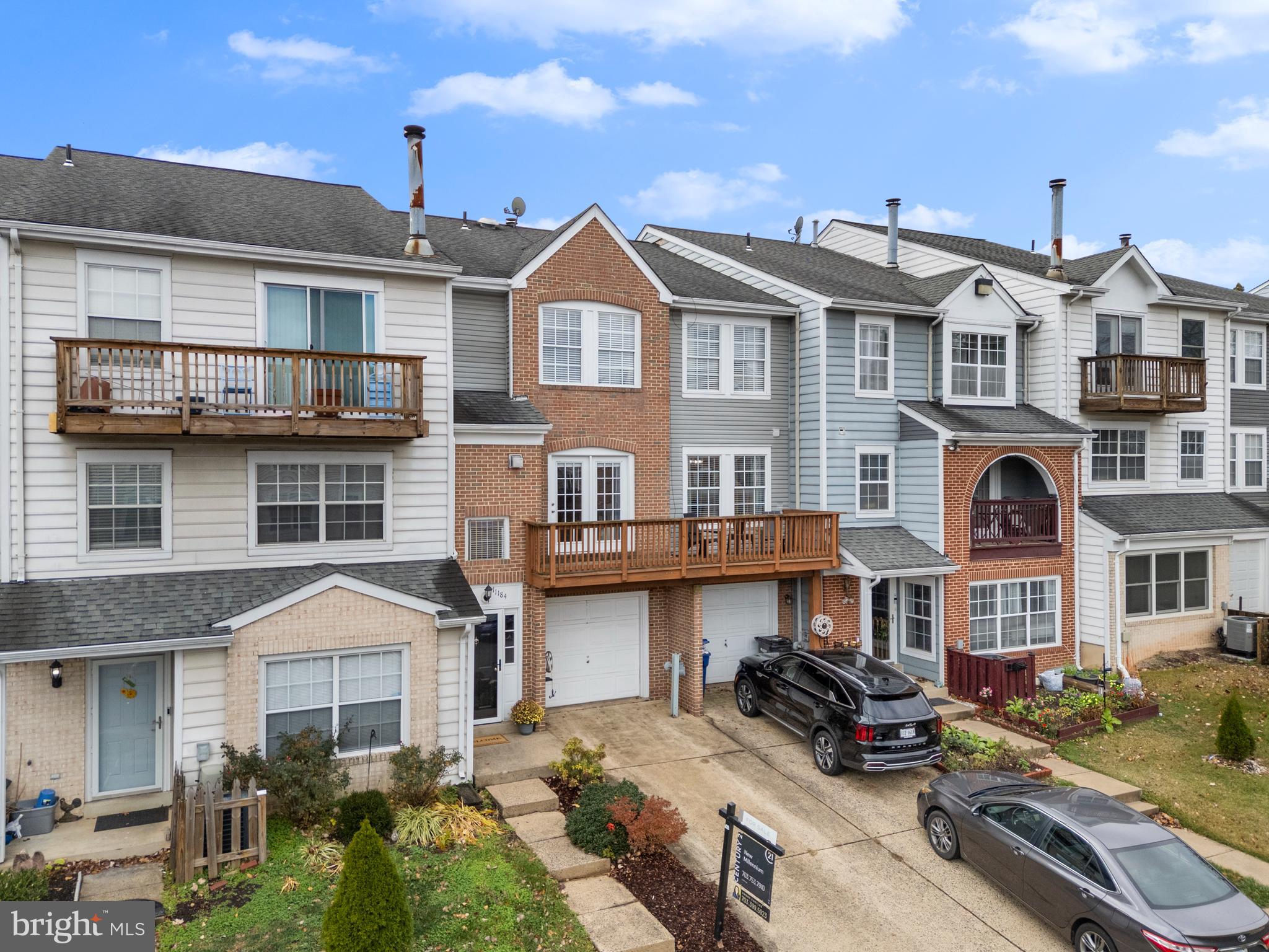 11184 Stagestone Way Manassas, VA 20109 - Photo 36 of 38 a view of a big house with many windows