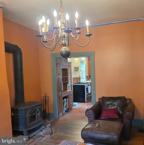 a view of a livingroom with furniture and chandelier