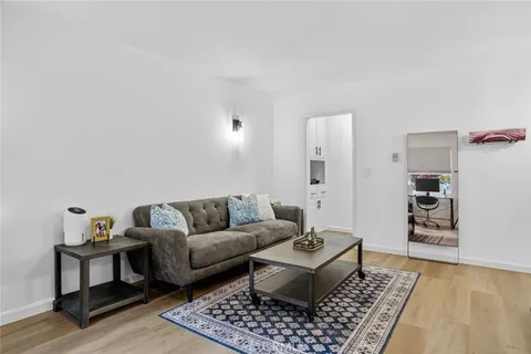 a living room with furniture and a rug