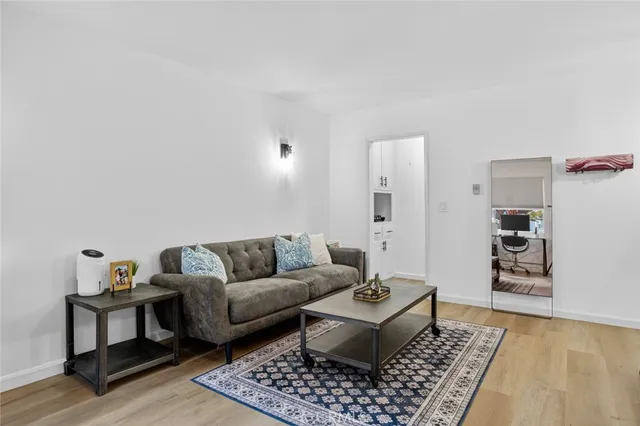 a living room with furniture and a rug