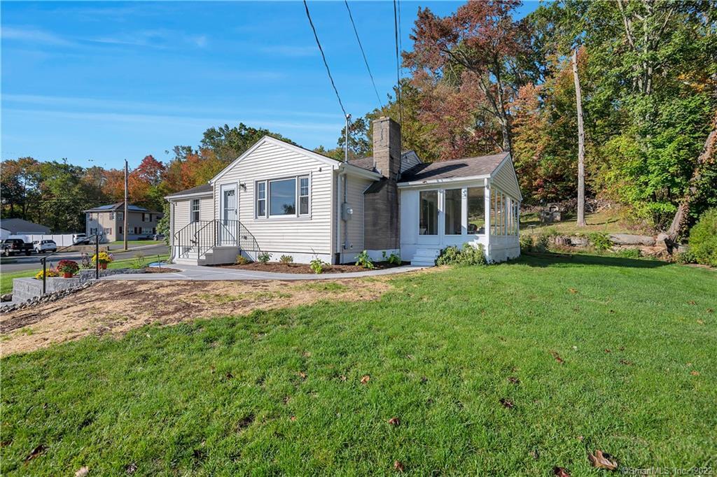 89 Stanley Road Hamden, CT 06514 - Photo 1 of 1 a front view of a house with a yard