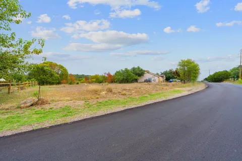 a view of a lake with a big yard