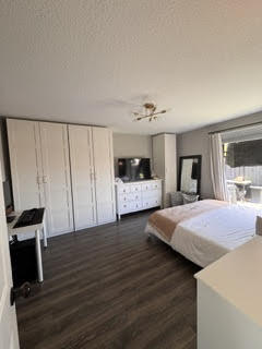 10267 Boca Bend West, Unit G4 Boca Raton, FL 33428 - Photo 12 of 21 a bedroom with a bed and a flat screen tv
