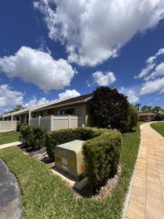 10267 Boca Bend West, Unit G4 Boca Raton, FL 33428 - Photo 18 of 21 a front view of a house with a yard