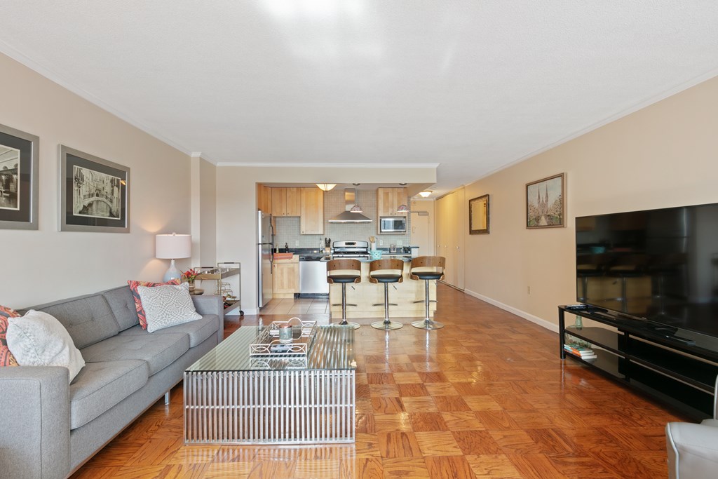 9 Hawthorne Place, Unit 9K Boston, MA 02114 - Photo 3 of 22 a living room with furniture and a flat screen tv