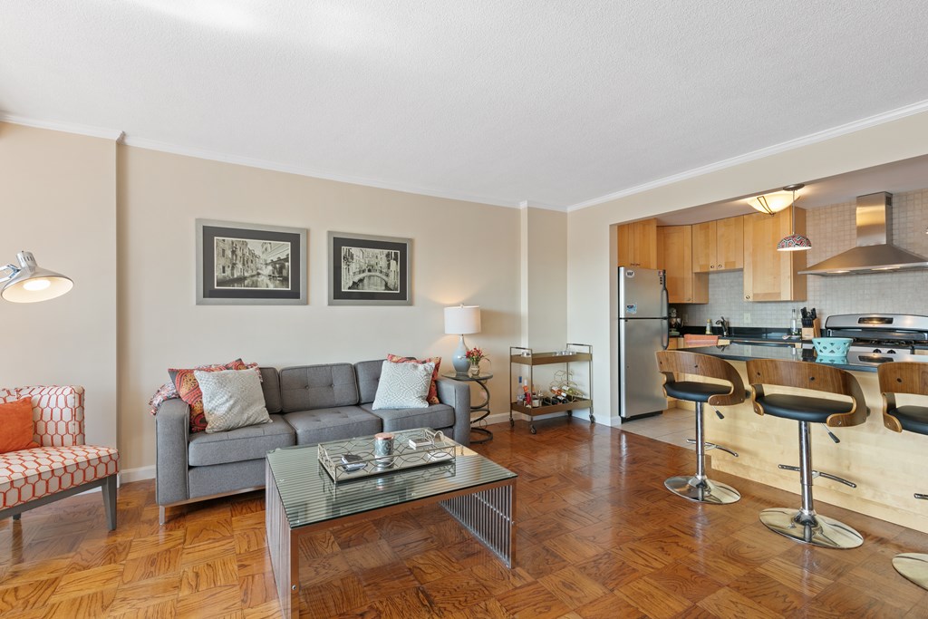 9 Hawthorne Place, Unit 9K Boston, MA 02114 - Photo 4 of 22 a living room with furniture and a large window