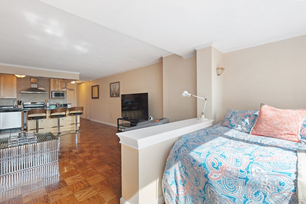 9 Hawthorne Place, Unit 9K Boston, MA 02114 - Photo 7 of 22 a bedroom with a bed and furniture