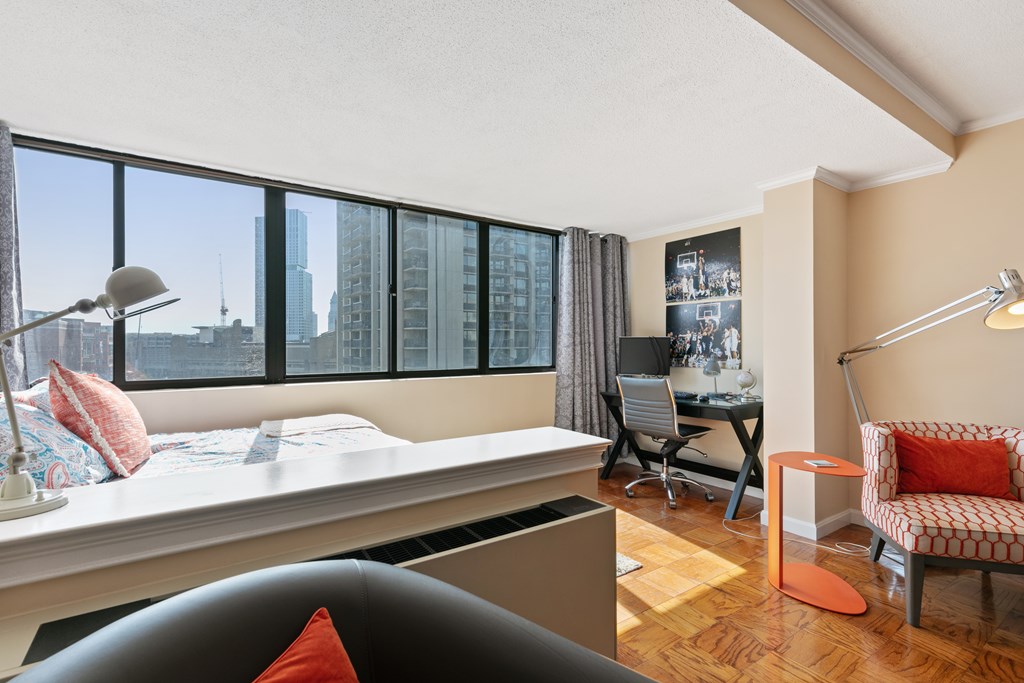9 Hawthorne Place, Unit 9K Boston, MA 02114 - Photo 8 of 22 a living room with furniture and a window