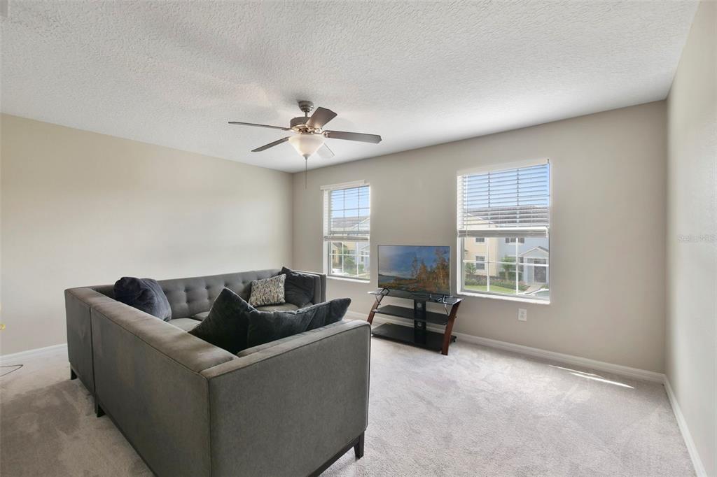 1209 Seburn Road Apopka, FL 32703 - Photo 12 of 25 a living room with furniture and a window