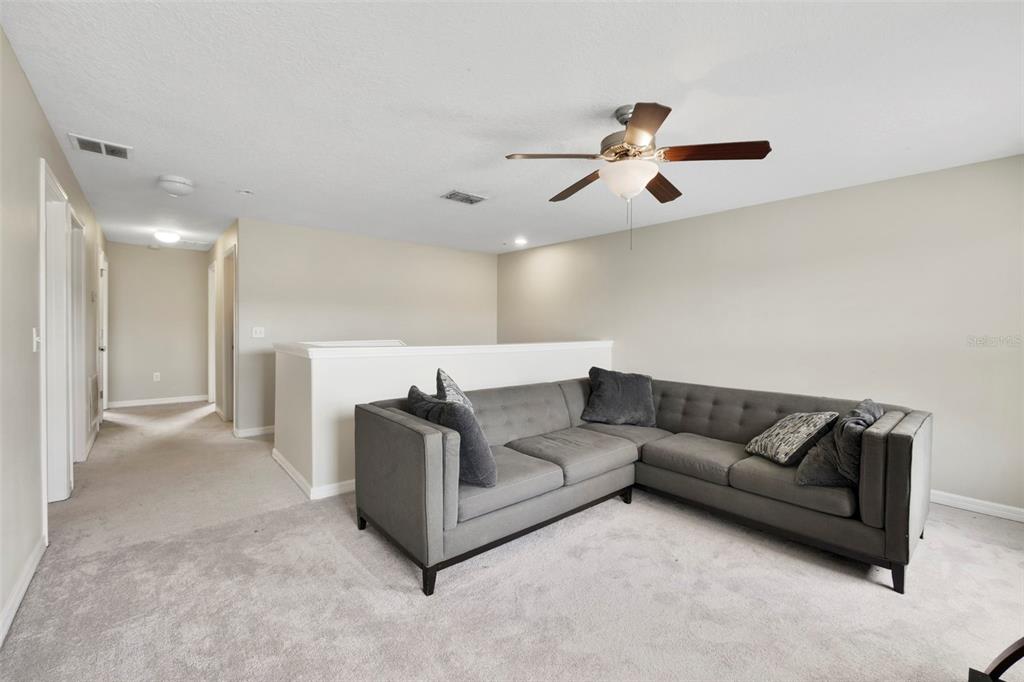 1209 Seburn Road Apopka, FL 32703 - Photo 13 of 25 a living room with furniture and a ceiling fan