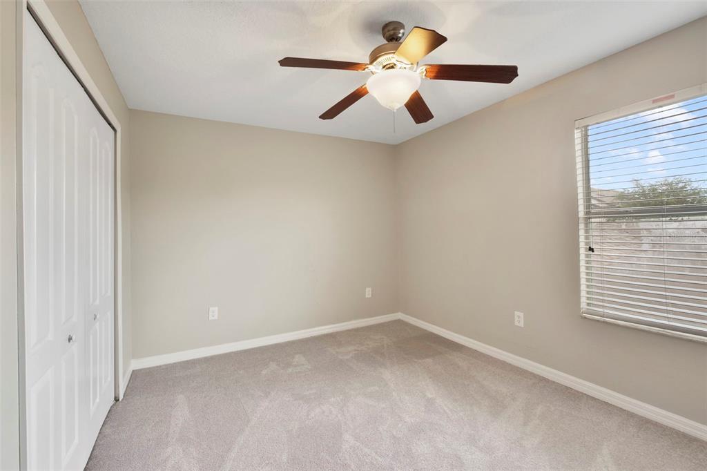 1209 Seburn Road Apopka, FL 32703 - Photo 15 of 25 an empty room with a window and a fan