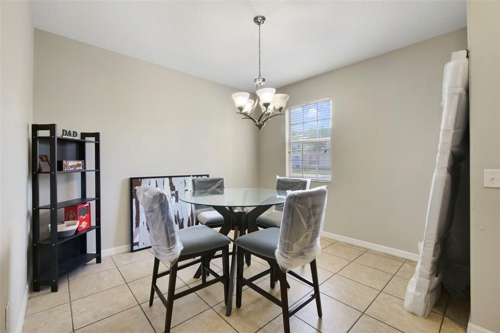 1209 Seburn Road Apopka, FL 32703 - Photo 8 of 25 a dining room with furniture and window