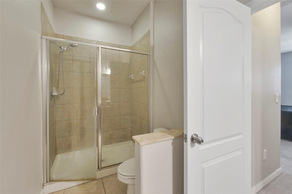 1209 Seburn Road Apopka, FL 32703 - Photo 10 of 25 a bathroom with a shower a toilet and a sink