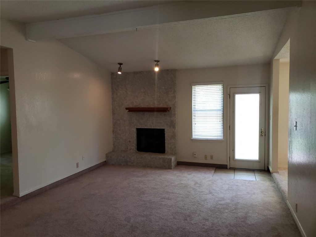 13212 Rampart Street Austin, TX 78727 - Photo 6 of 12 living area with cozy fireplace