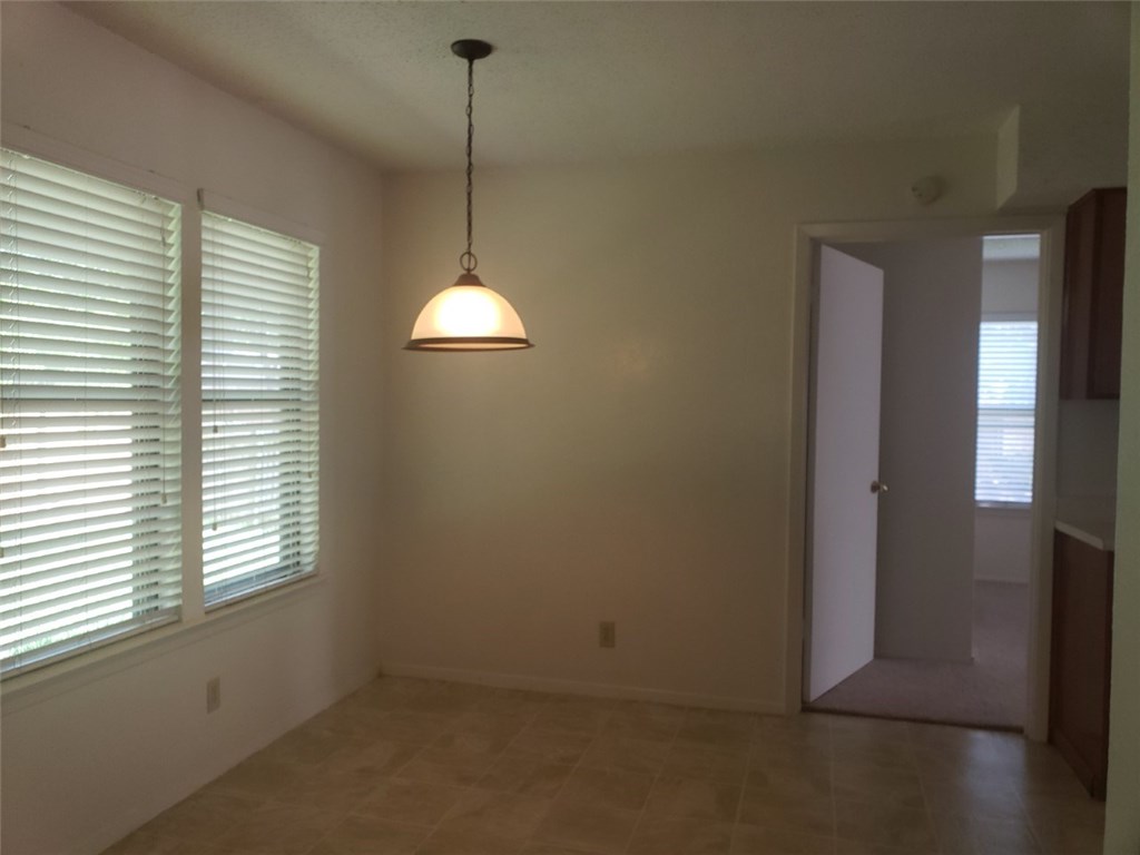 13212 Rampart Street Austin, TX 78727 - Photo 7 of 12 Master bedroom is on one side of the home just off kitchen and breakfast area.