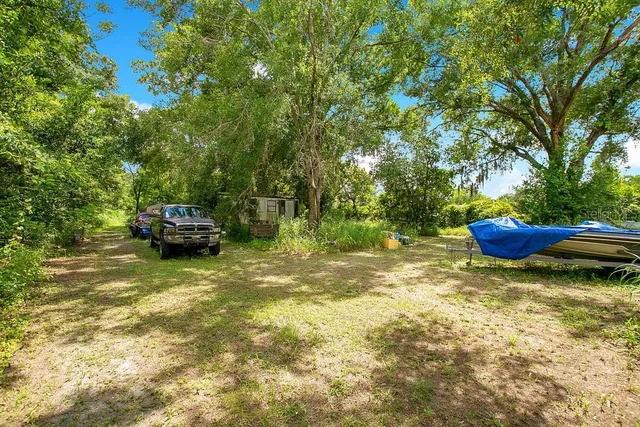 a backyard of a house with lots of green space