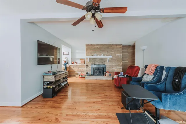 a view of hallway with wooden floor