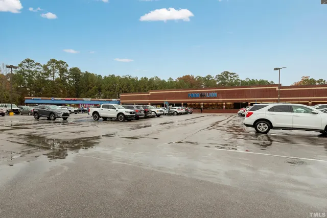 a view of a street with a building and a street sign