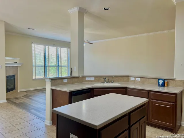 a view of an empty room and wooden floor