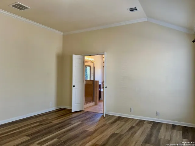 a view of kitchen with sink and mirror