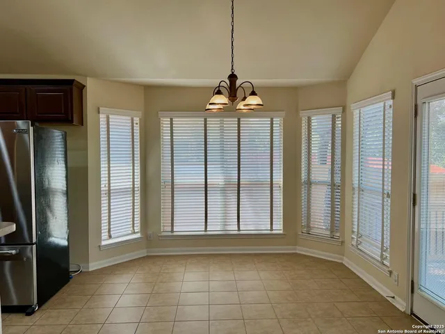 a view of balcony with wooden fence
