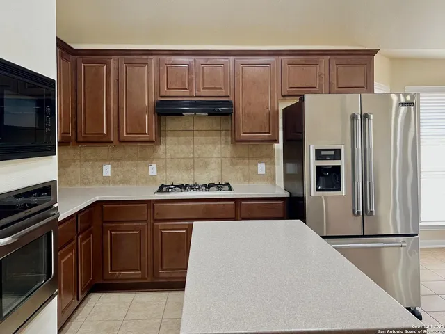a kitchen with a sink and a window