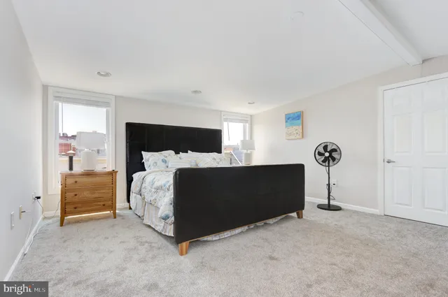 a bed room with a bed and a table