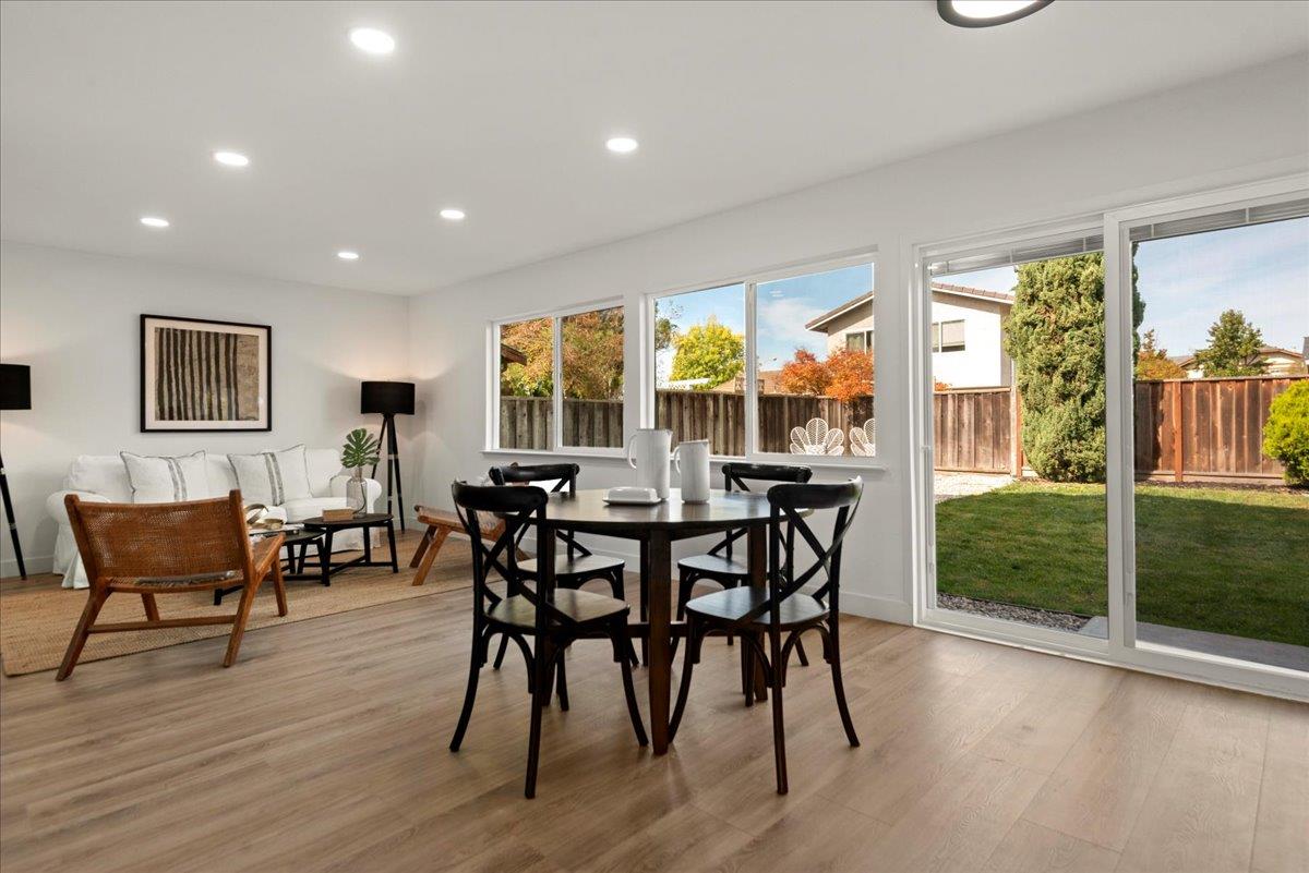 8261 Olympic Court Newark, CA 94560 - Photo 15 of 40 a view of a dining room with furniture window and wooden floor