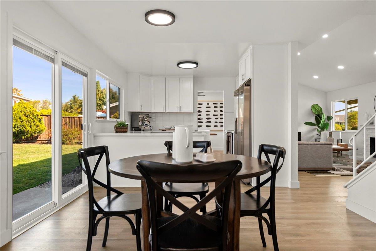 8261 Olympic Court Newark, CA 94560 - Photo 18 of 40 a view of a dining room with furniture and wooden floor