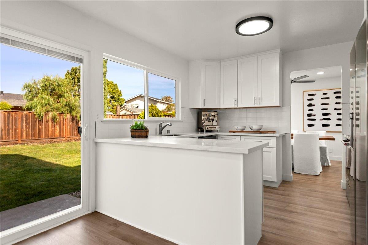 8261 Olympic Court Newark, CA 94560 - Photo 20 of 40 a kitchen with a sink window and cabinets