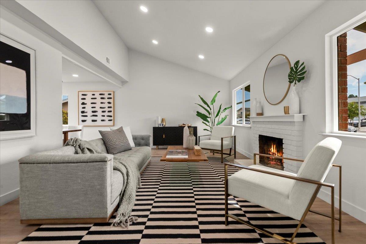 8261 Olympic Court Newark, CA 94560 - Photo 4 of 40 a living room with furniture a fireplace and window