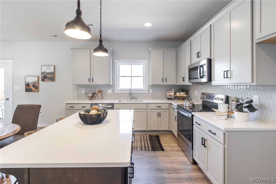 13140 Beach Road Chesterfield, VA 23832 - Photo 11 of 34 a kitchen with a white cabinets and white appliances