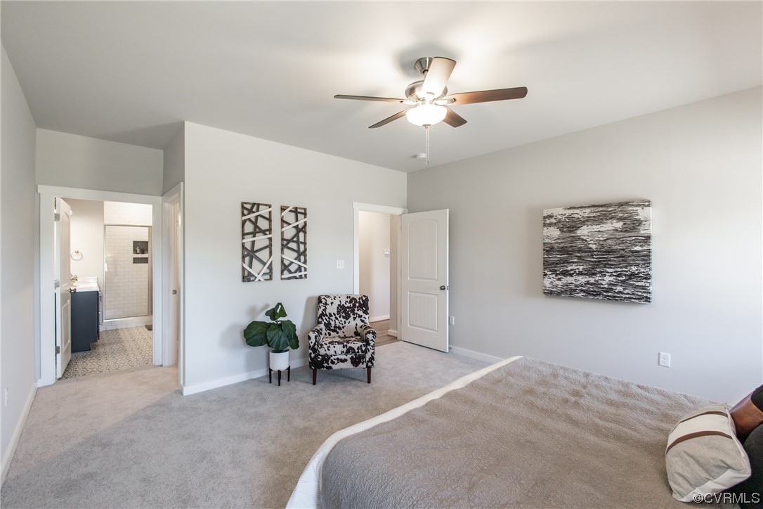 13140 Beach Road Chesterfield, VA 23832 - Photo 18 of 34 a bed room with a bed and a chandelier
